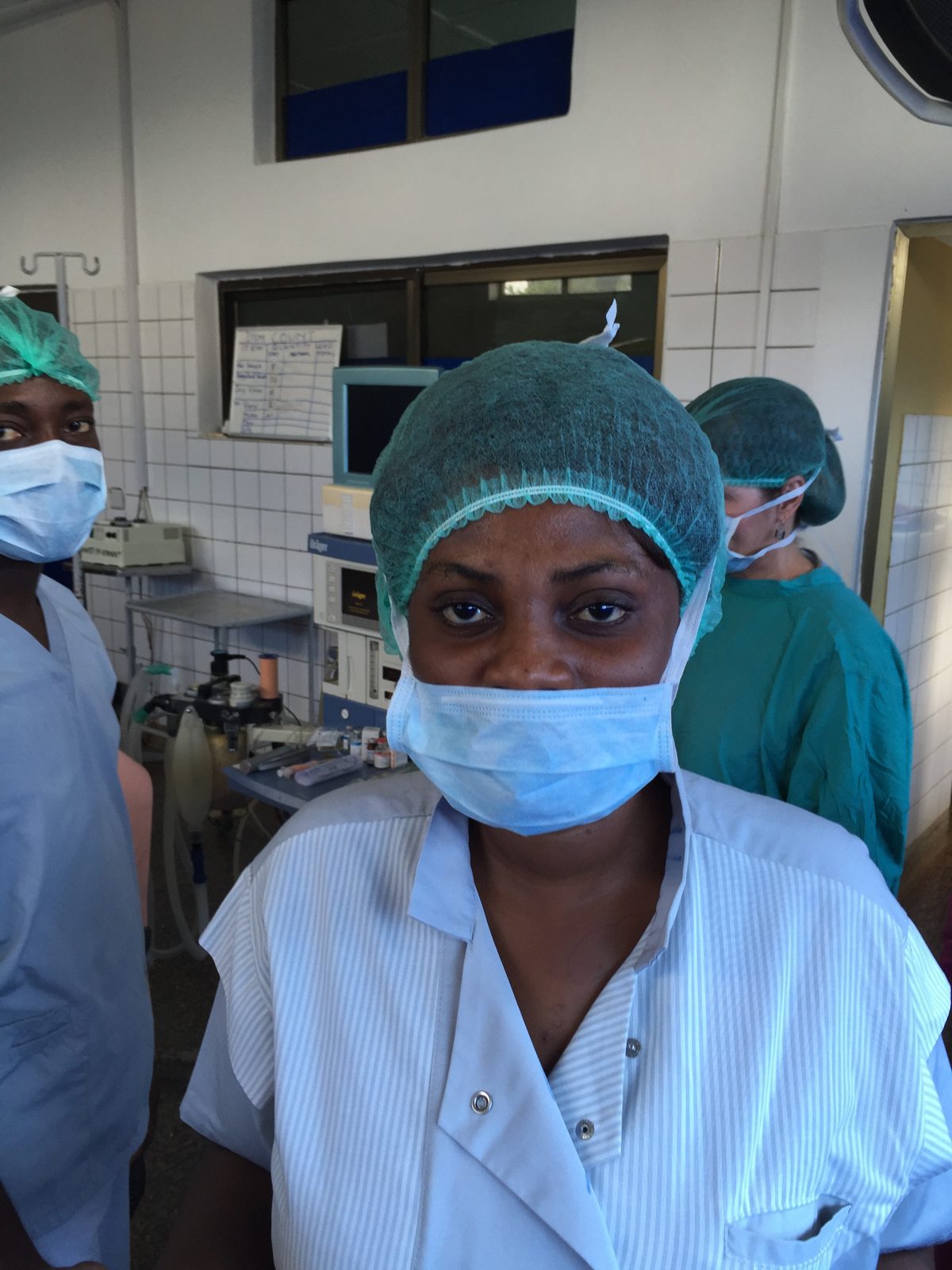 A local surgical team member in cap and mask in the theater